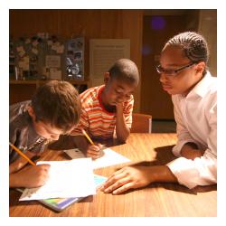 3 boys reading and doing homework