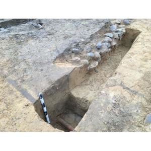 Excavation Site showing Stone Foundation and Drain Pipe