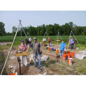 Volunteers Sue S. and Neil W. pause during block excavations at the OPS Site, July 10, 2019