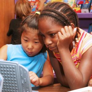 Two girls reading