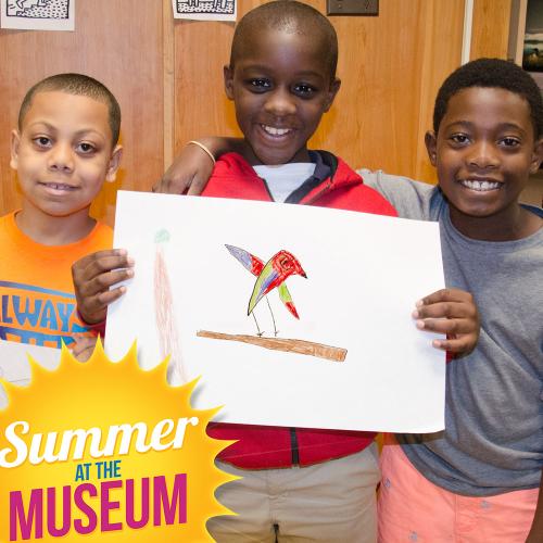 Group of boys with hand drawn picture of red bird