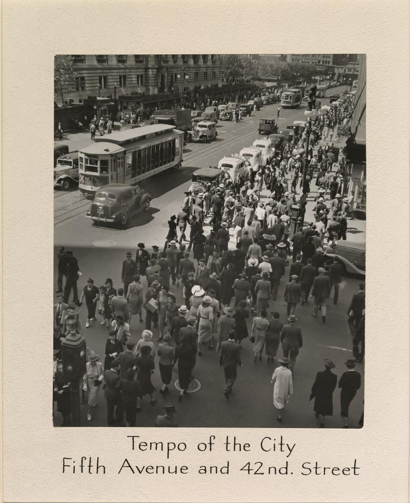 Historical photo of crowds on the streets of New York City. 